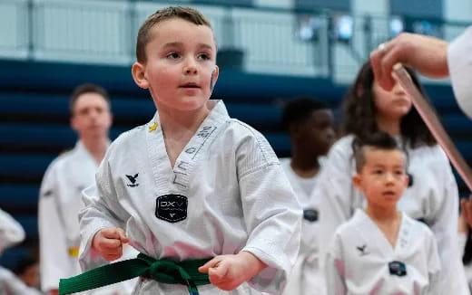 a boy in a karate uniform