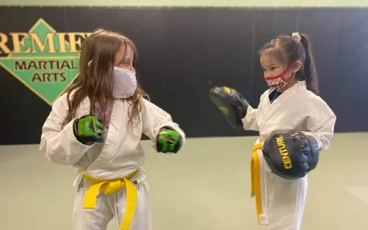 a couple of girls wearing clothing