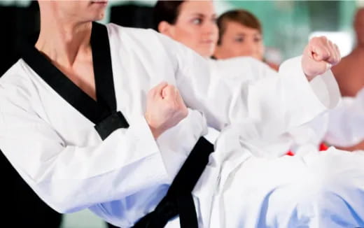 a group of people in karate uniforms