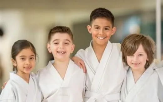 a group of people wearing white shirts