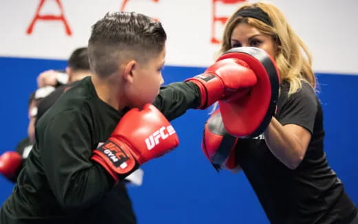 a man and woman boxing