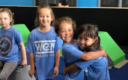a group of children sitting on a bench