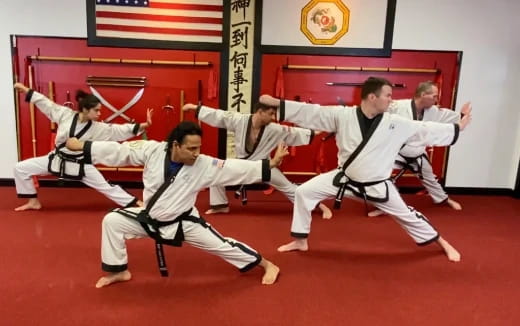 a group of people in karate uniforms