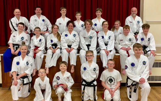 a group of people in white uniforms