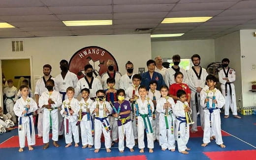 a group of people in karate uniforms