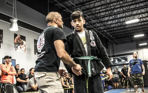 a person shaking another man's hand