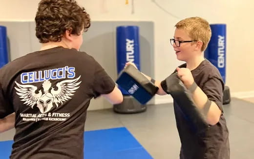 a couple of boys looking at a box