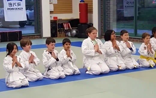 a group of children sitting on the floor