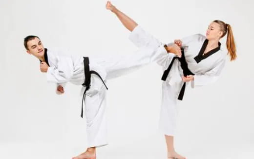 a few people in karate uniforms