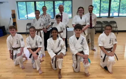 a group of people in white uniforms