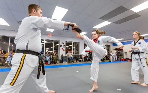 a group of people in karate uniforms