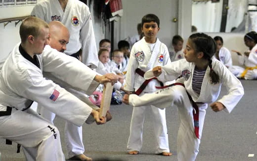 a group of people in karate uniforms
