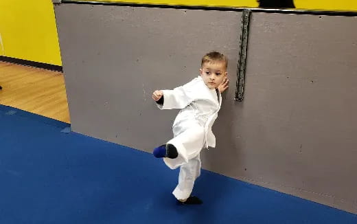 a child in a white suit