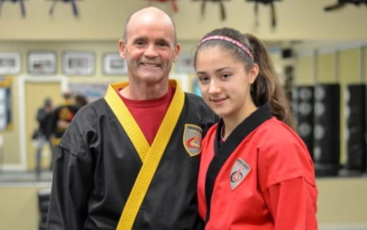 a man and a woman smiling