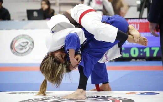 a couple of people wrestling