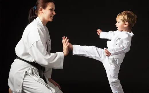 a man and a child in karate uniforms