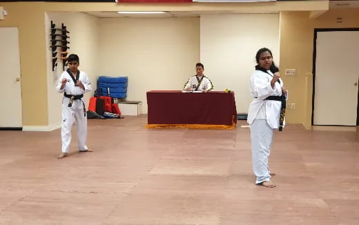 a group of people in white uniforms