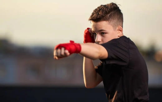 a person wearing boxing gloves