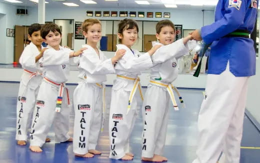 a group of people in karate uniforms