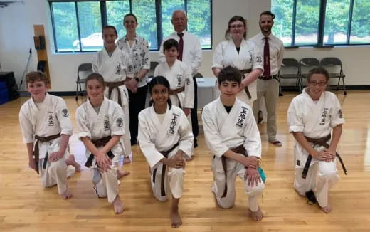 a group of people in white uniforms