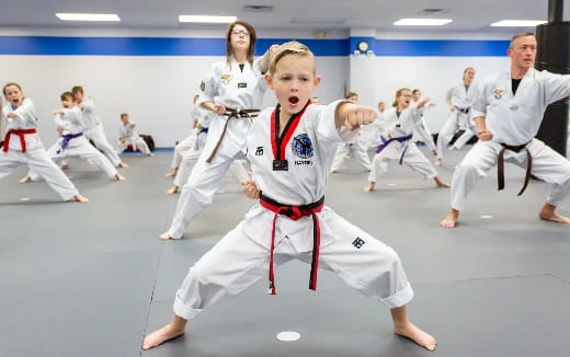 a group of people in karate uniforms