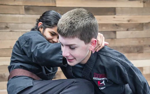 a woman hugging a man