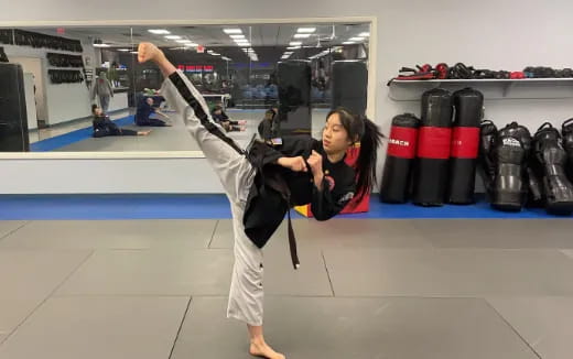 a person doing a handstand in a gym