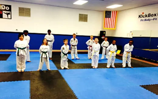a group of people in karate uniforms