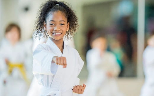 a young girl in a white coat