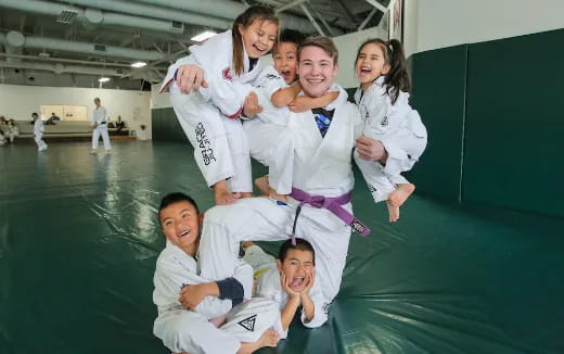 a group of people in karate uniforms