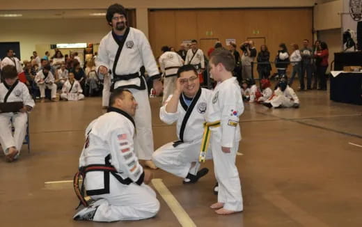 a group of people in karate uniforms
