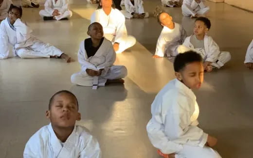 a group of people sitting on the floor