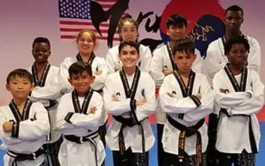 a group of people in white uniforms