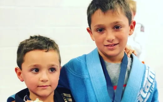 a couple of boys posing for the camera