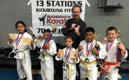 a group of people in karate uniforms