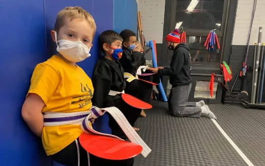 a group of kids wearing clothing