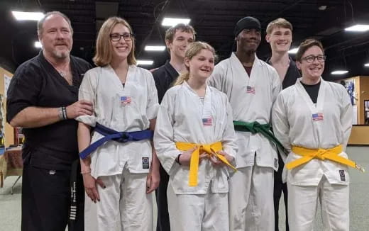 a group of people in white uniforms