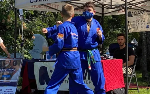 two men in blue uniforms