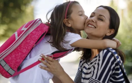 a few young girls embracing