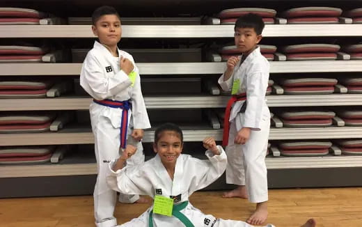 a group of boys in karate uniforms