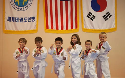 a group of people in karate uniforms