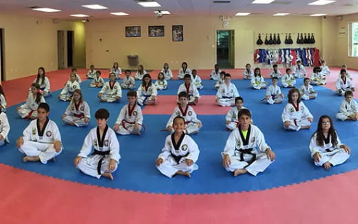 a group of people sitting on the floor
