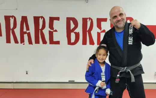 a man and a girl posing for a picture
