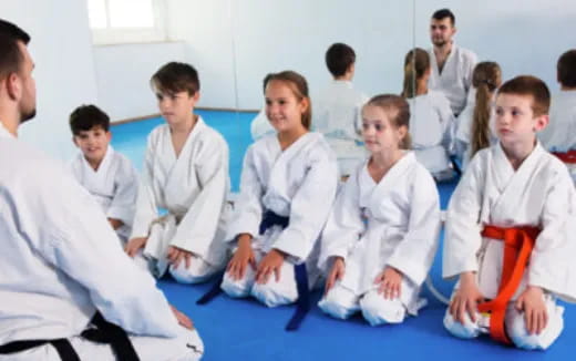 a group of people in white uniforms