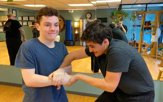 a person holding another man's hand