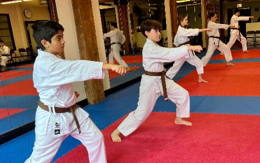 a group of boys practicing martial arts