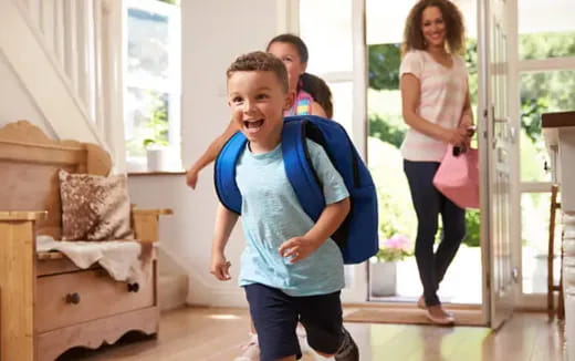 a boy running in a room