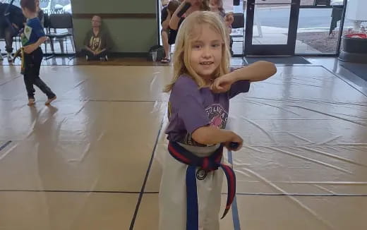 a girl riding a toy bike