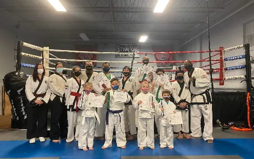 a group of people in white suits