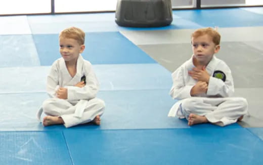 two boys in karate uniforms